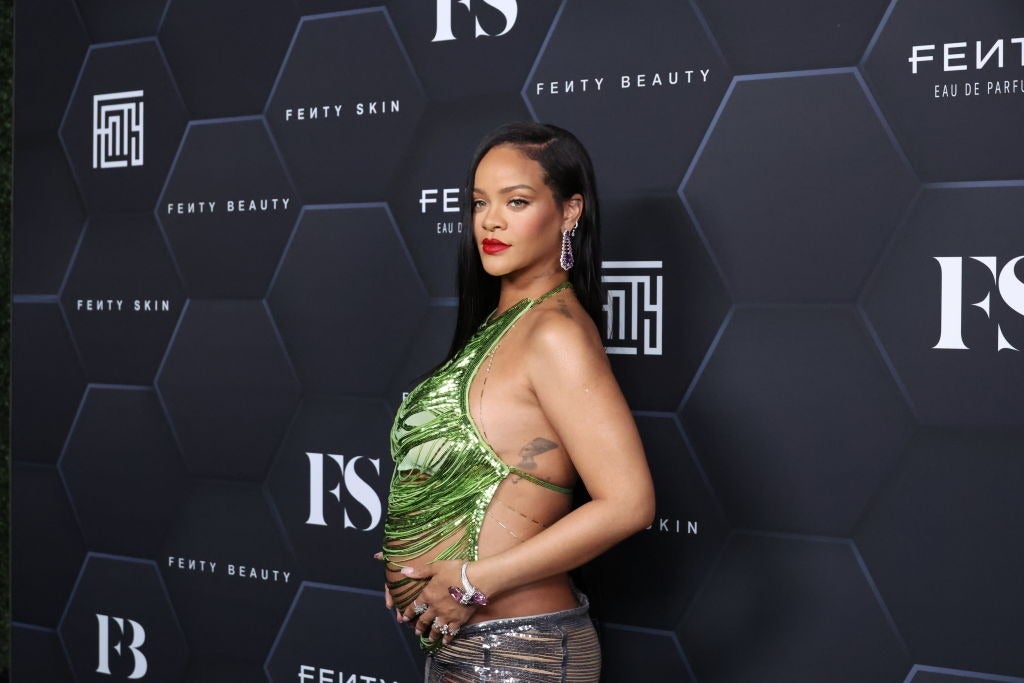 Rihanna spills out of purple bra as she admits she's 'usually