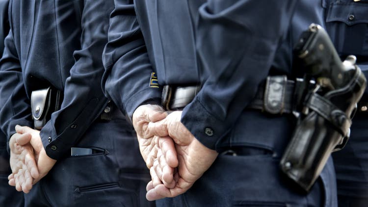 Officers standing.