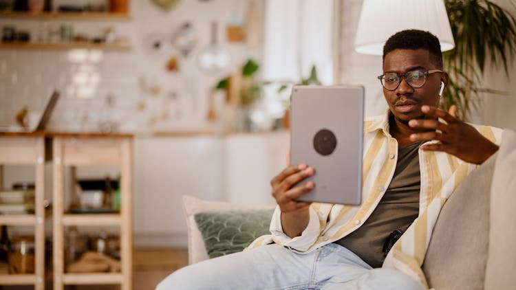 Young Black man using telemedicine to seek mental health services