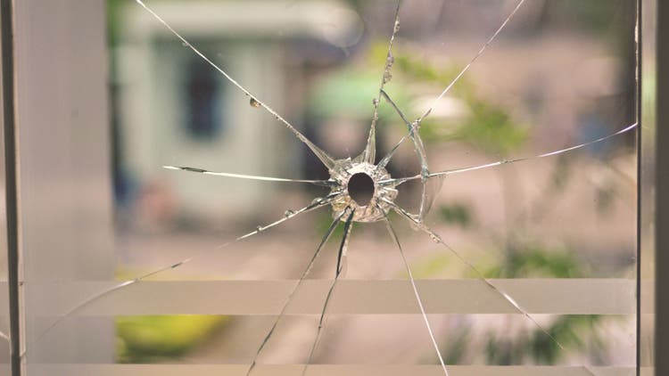 Gunshot through window