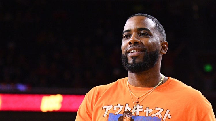 Rapper Reason (Robert Lee Gill, Jr.) looks on during the college basketball game between the UCLA Bruins and the USC Trojans on March 7, 2020 at Galen Center in Los Angeles, CA.