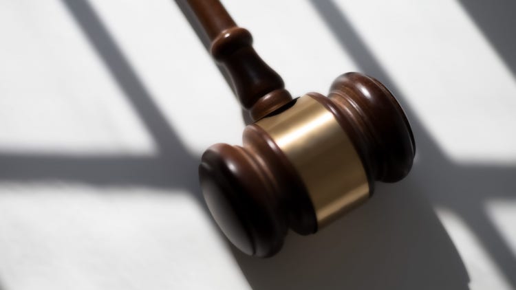 judge’s traditional wooden gavel on white background & shadow detail