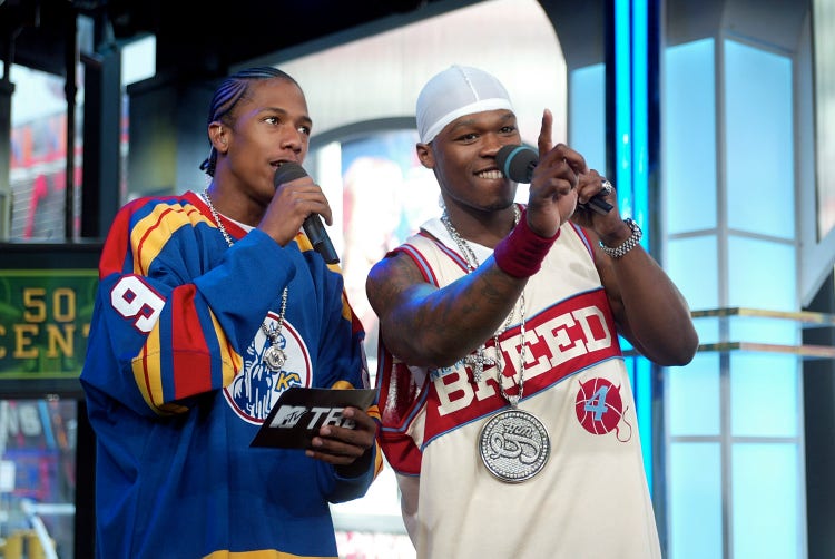 Rapper 50 Cent (R) and VJ Nick Cannon kick off