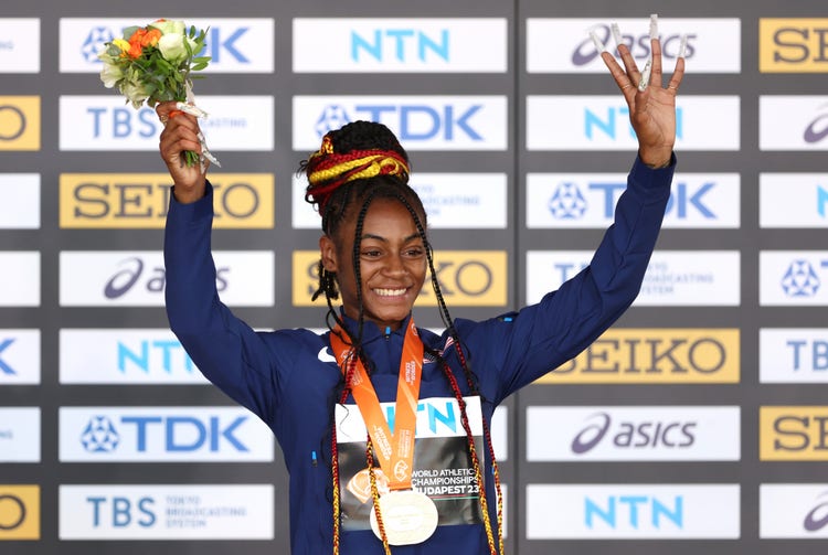 Gold medalist Sha'Carri Richardson of Team United States poses for a photo on the podium during the medal ceremony for the Women's 100m during day four of the World Athletics Championships Budapest 2023 at National Athletics Centre on August 22, 2023 in Budapest, Hungary.