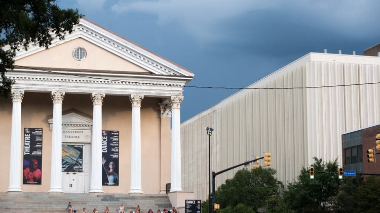 College students eat dinner at the Longstreet Theatre at the University of South Carolina on August 10, 2020 in Columbia, South Carolina