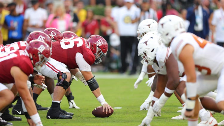 Seth McLaughlin #56 of the Alabama Crimson Tide lines-up over the ball during the first quarter against the Texas Longhorns at Bryant-Denny Stadium on September 09, 2023 in Tuscaloosa, Alabama.