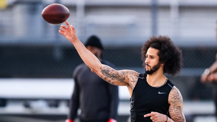 Colin Kaepernick looks to pass during his NFL workout held at Charles R Drew high school on November 16, 2019 in Riverdale, Georgia.